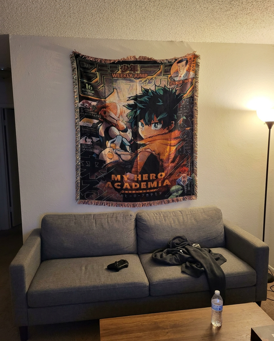 Deku tapestry above a living room couch
